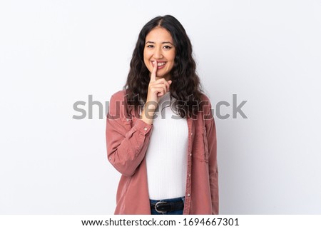 Spanish Chinese woman over isolated white background doing silence gesture