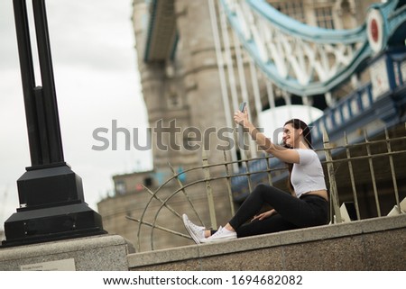 young woman in london taking a selfie