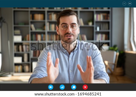 Businessman participate at virtual distant negotiations with colleagues via teleconference. Talk with clients provide information strategizing remotely. Video call self-isolation during ncov situation Royalty-Free Stock Photo #1694685241