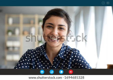 Laptop web cam view head shot of indian woman. E-date online services, video call using phone or pc, distance chat with mates common task, conversation between friends, job interview remotely concept Royalty-Free Stock Photo #1694685328