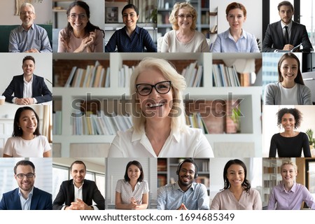 Webcam pc screen view during group video call, many faces diverse colleagues participating in on-line meeting led by mature 50s businesslady, e-coaching, video conferencing, worldwide app easy usage Royalty-Free Stock Photo #1694685349