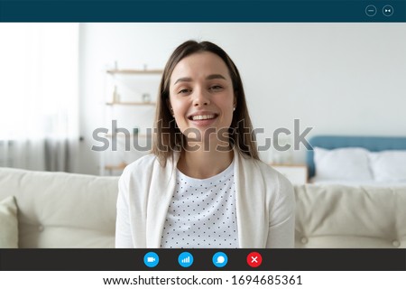 Woman sit on sofa in living room look at cam talk by videocall with friend relatives, head shot. Pass job interview answering questions. Distant chat with verified psychiatrist or psychologist concept Royalty-Free Stock Photo #1694685361