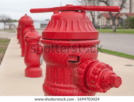 different types of red fire hydrants in the city