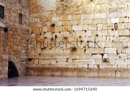 The Western Wailing Wall Kotel Empty in Jerusalem old city, Israel.The Wall is the holiest place where Jews are permitted to pray, though the holiest site in the Jewish faith lies behind it. Royalty-Free Stock Photo #1694715640