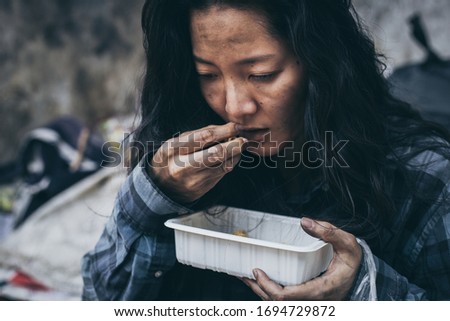 poor people or beggar begging you for help sitting at dirty slum.concept for poverty or hunger people,human rights,donate and charity for underprivileged children in third world 