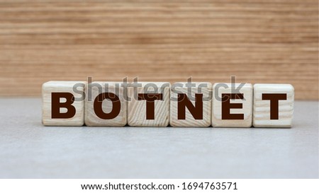 concept of the word BOTNET on cubes on a wooden background