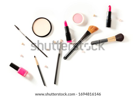 Professional makeup on a white background. Brushes, lipstick and other products, a flat lay with a place for text