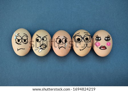 Funny eggs expressions concept with different emotions isolated on flat black background.