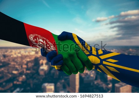 Shaking hands Afghanistan and Greek Macedonia