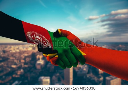 Shaking hands Afghanistan and East Timor