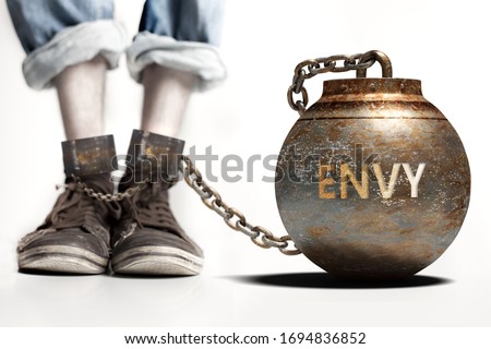 Envy can be a big weight and a burden with negative influence - Envy role and impact symbolized by a heavy prisoner's weight attached to a person, 3d illustration Royalty-Free Stock Photo #1694836852