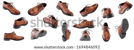 Classic brown men's oxfords shoes, with Derby type lacing, isolated on a white background in different angles and positions, casual shoes for office Royalty-Free Stock Photo #1694846092