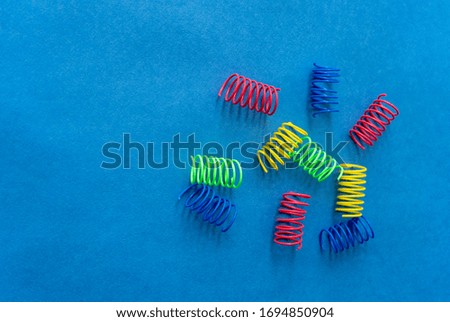 Color springs on a blue background. Colorful