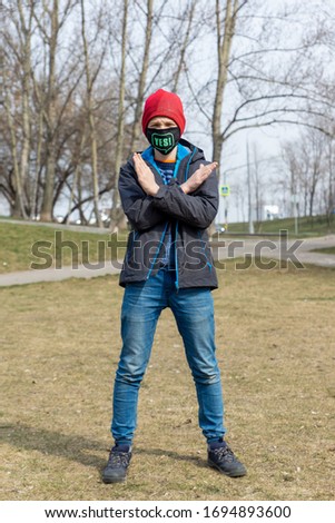 teenager with mask in park