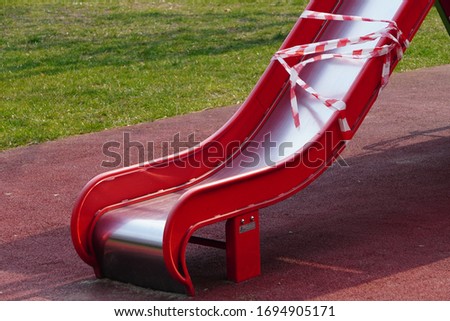 Children's playground is closed. Ban on children 's playgrounds. Prevention of coronavirus COVID-19. The fight against the virus. No children on the Playground in the yard. Royalty-Free Stock Photo #1694905171