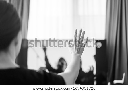 Woman praying and worship to GOD with church online sunday service.Live Church with bible.Woman raise hands for praise and worship the LORD.Home church.Quarantine from Covid-19 Coronavirus pandemic Royalty-Free Stock Photo #1694931928