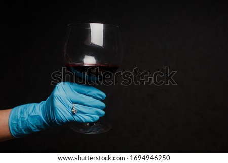 engagement ring on the hand with a glove