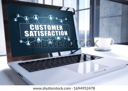 Customer Satisfaction text on modern laptop screen in office environment. 3D render illustration business text concept.
