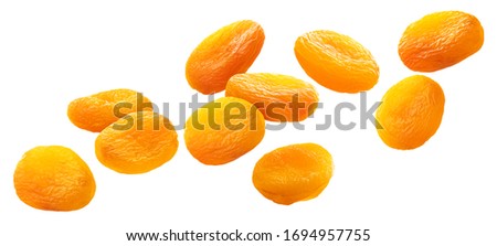 Falling dried apricots isolated on white background with clipping path Royalty-Free Stock Photo #1694957755