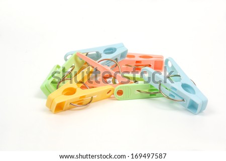 Color clothes-pegs over white