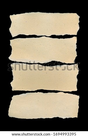 Brown and beige corrugated cardboard pieces, isolated on black background
