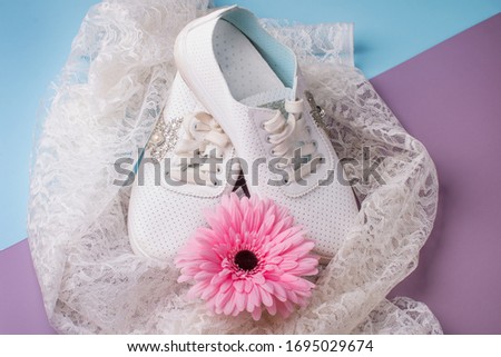 Beautiful elegant women's shoes, and a White drapery background.