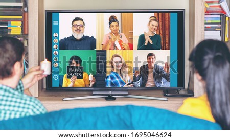 Multicultural people on video call celebrating 2020 Easter holiday from home isolation due to Covid-19 pandemic quarantine – friends having virtual fun on live streaming platform expressing friendship Royalty-Free Stock Photo #1695046624