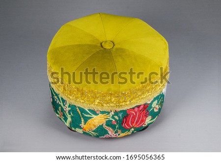 Comfortable soft pouf in interion background.