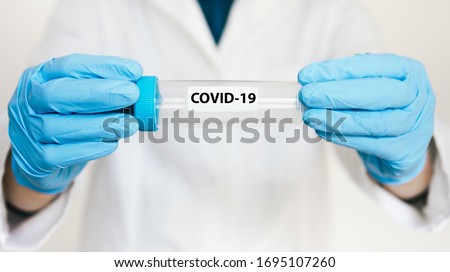 Female Scientist Medical Research Lab researching test tubes virus coronavirus covid - 19 in laboratory