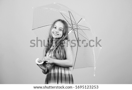 Feeling protected at this autumn day. autumn weather forecast. rainy weather. Fall mood. carefree childhood. autumn fashion. small girl with umbrella. Time to relax.