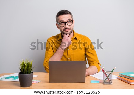 Portrait of dream dreamy man work home in coronavirus quarantine use laptop look copyspace think thoughts create development report wear yellow shirt isolated over grey color background Royalty-Free Stock Photo #1695123526