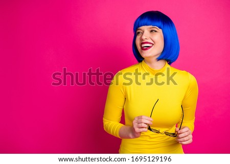 Photo of attractive funny lady modern look hold retro specs hands laughing listen humor jokes wear stylish yellow turtleneck blue short blue wig isolated vibrant pink color background