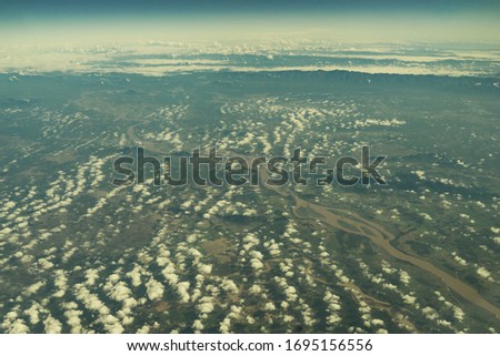 Sunset clouds from above. Abstract wallpaper concept. Copy space. High attitude shot. 