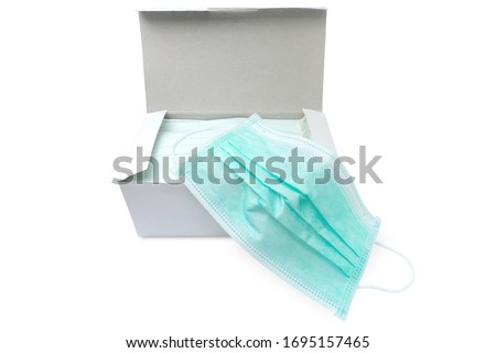 Pack of ear loop medical masks in box with medical mask on top isolated on white background with clipping path. anti virus and bacteria protective face air pollution, environmental concept.