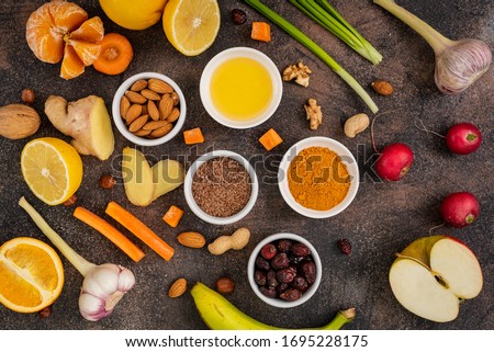 Healthy foods to enhance immunity on a dark background. Vegetables and fruits to strengthen the immune system. Top View.