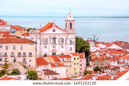 View of Saint Stephen Church  in Lisbon from Miradouro de Santa Luzia viewpoint, Portugal. 
