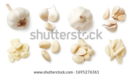 Set of fresh whole and sliced garlics isolated on white background. Top view Royalty-Free Stock Photo #1695276361