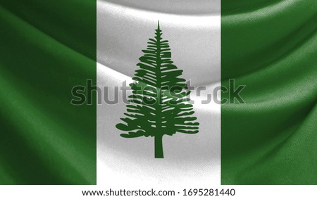 Realistic flag of Norfolk Island on the wavy surface of fabric