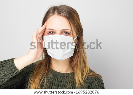 Headache for illness. Woman with medical mask. Symptoms of corona virus disease.