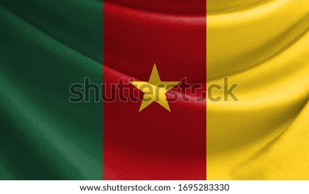 Realistic flag of Cameroon on the wavy surface of fabric