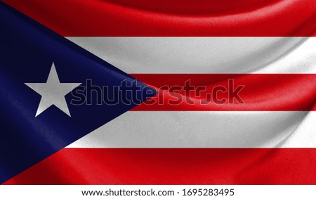 Realistic flag of Puerto Rico on the wavy surface of fabric