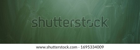 Blank green chalkboard, blackboard texture, banner size, panorama, with copyspace for your individual text. 