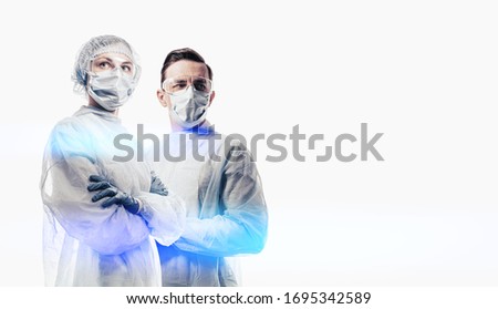 doctors man and woman on a white background in medical masks on the face Royalty-Free Stock Photo #1695342589