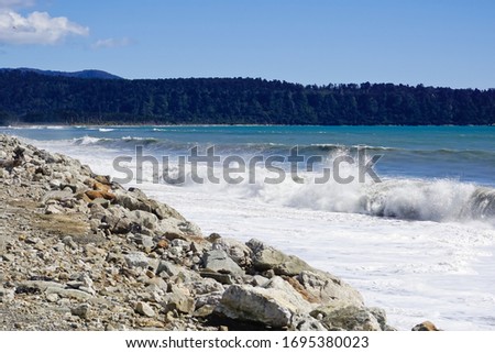 Ocean waves in windswept beach of Bruce bay in Westland national park South Island New Zealand 