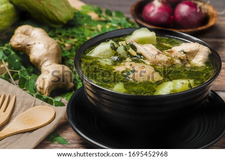 Tinola (Close Up)- a famous Filipino vegetable soup dish that is usually made from ginger, fish sauce and chicken broth, usually mixed with  moringa and chayote
