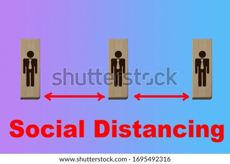 symbols of people on wooden blocks separated by a red line, the concept of a virus epidemic, quarantine, maintaining social distance between people