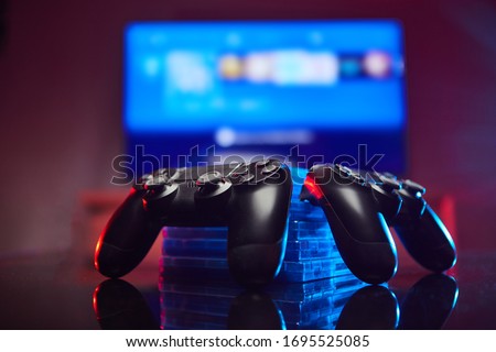 Game controller, videogame joystick or gamepad on a table. Close up studio shot Royalty-Free Stock Photo #1695525085