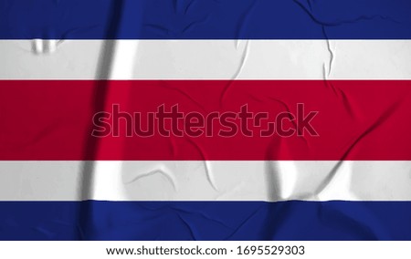 Costa Rica flag on crumpled paper background.
