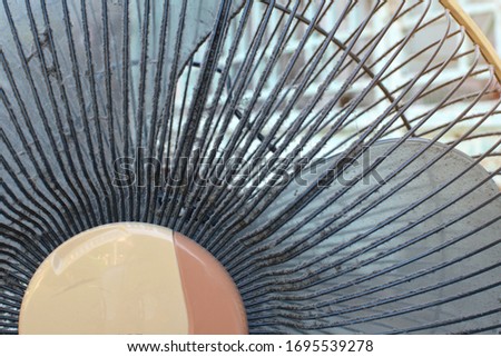 close up hat sticks to the cover of the fan