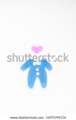 Blue suit with a pink heart instead of a head. On a white background.
